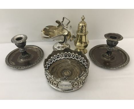 A collection of vintage silver plated items.  To include: a pair of candlesticks, wine bottle coaster, sugar sifter and sugar