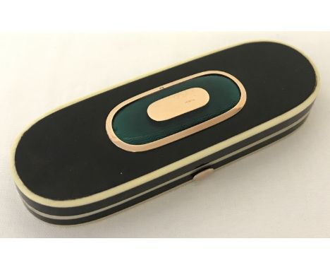 A rounded rectangular hinged tortoiseshell, ivory, gold and guilloche patchbox.  Tortoiseshell body trimmed with ivory inlay 
