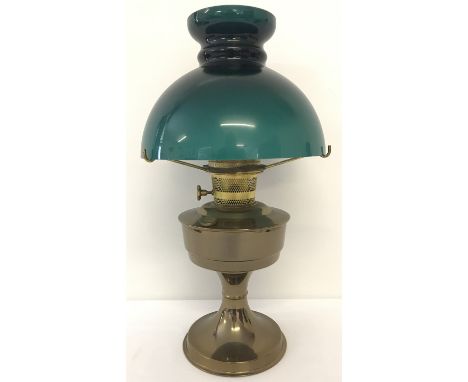 A vintage brass based "Aladdin" oil lamp complete with green glass shade.   Approx. 45cm tall to top of shade.