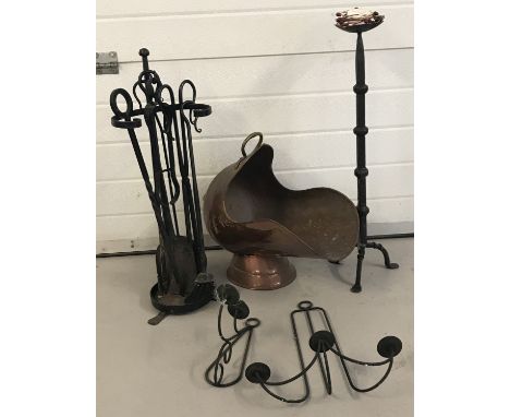 A collection of vintage metal ware items.  Comprising: companion set, copper coal scuttle, wrought iron candle stick and 2 bl