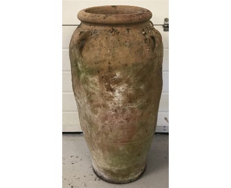 A large vintage terracotta garden urn with four small handles on the shoulders.  Approx. 78cm tall x 41cm dia.