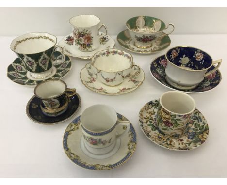 A collection of 8 cups &amp; saucers and coffee cans.  To include Crown Devon, Noritake, Royal Albert "Buckingham" and Parago