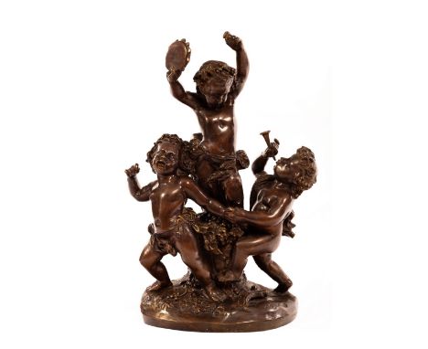 A large French bronze Bacchus group of three putti, the central raised figure with tambourine, another with a pipe, the third