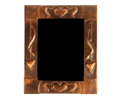 An Arts & Crafts style copper mirror, the frame embossed heart motifs, 44cm x 36cm/see illustration CONDITION REPORT: Scratch