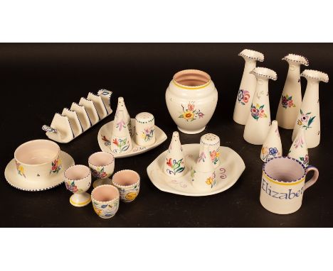 Poole Pottery, two condiment sets with trays, two oil and vinegar bottle sets, four mis-matched egg cups, a salt and pepper p