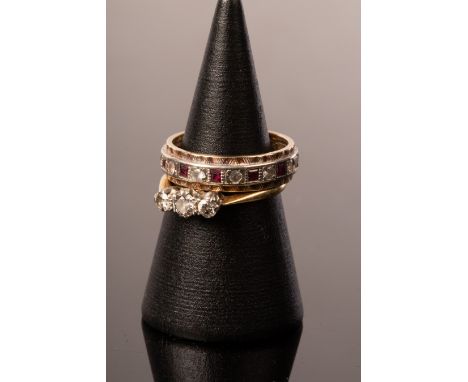 A diamond three-stone ring, set in 18ct gold and platinum, size K and a 9ct gold eternity ring  CONDITION REPORT: Condition i