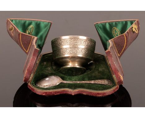 A Victorian silver Christening bowl and spoon, Martin & Hall, Sheffield 1868, with bands of scrolling decoration, the bowl 10