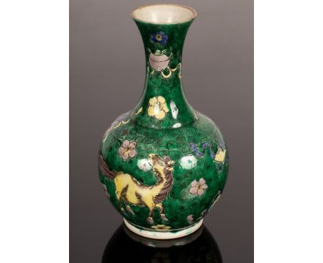 A Kangxi style famille verte vase, decorated green and black swirls, a purple and yellow horse, flowers and emblems, 17cm hig