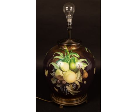 A porcelain vase painted fruit, 67cm high (now a lamp with shade) CONDITION REPORT: Condition information is not usually prov