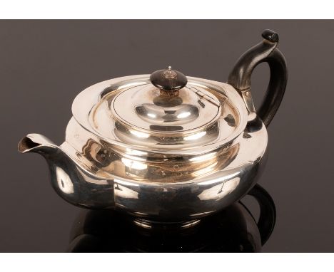 A George IV silver teapot, Emes &amp; Barnard, London 1823, of compressed circular form with ebonised finial and handle, appr