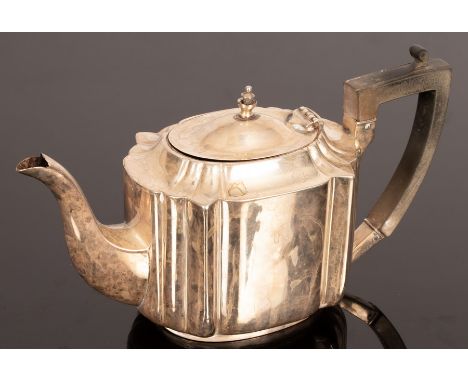 A silver teapot, London circa 1910, (marks rubbed), monogrammed, 23cm wide CONDITION REPORT: Condition information is not usu