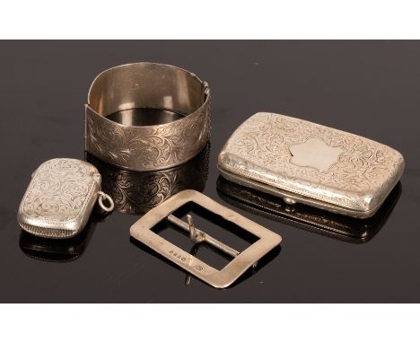 An engraved silver vesta case, Birmingham 1901, an engraved silver cigarette case, a silver buckle and an engraved bangle, ap
