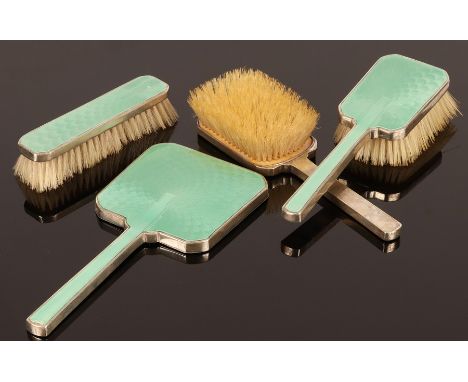 An Art Nouveau silver and green guilloché enamel backed dressing table set, Adie Bros., Birmingham 1936, comprising two hairb