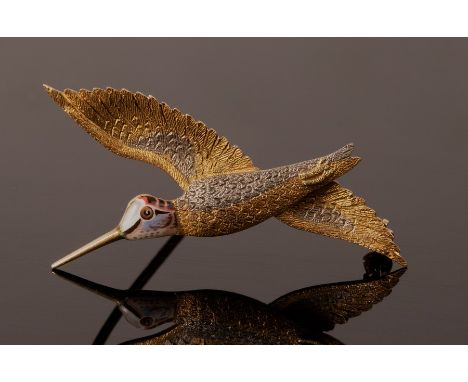 An early 20th Century novelty brooch of snipe form, in bi-colour 18ct gold and enamel, modelled flying, 42mm wing span, appro