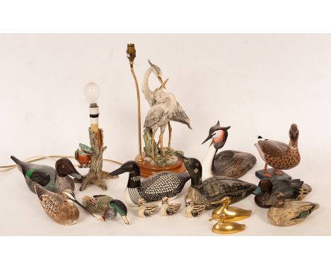 A quantity of carved and painted wooden birds, the largest 35cm long, two brass birds and two pottery lamp bases CONDITION RE