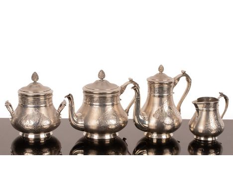 A French silver tea and coffee set, .950 standard, Christofle, circa 1900, the pieces with pine cone finials, Greek key decor