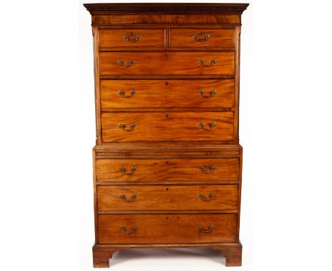 A George III mahogany tallboy chest, the top with dentil cornice and fitted three long and two short drawers with canted side