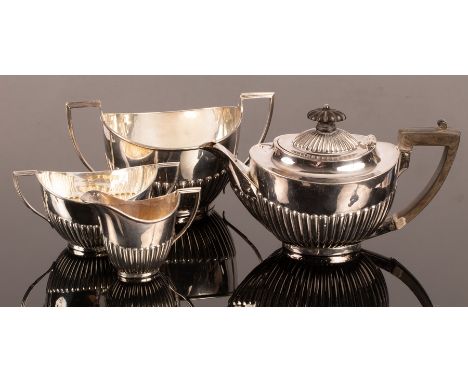 A bachelor's silver tea set, the teapot Mackay &amp; Chisolm, Edinburgh 1905, the sugar basin and jug Roberts &amp; Belk, She