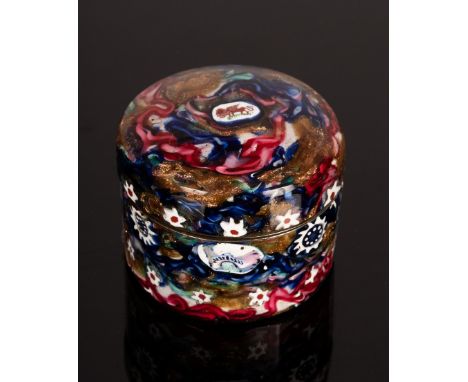 A circular snuff box, the metal overlaid with glass millefiori canes with faceted sides, 4cm diameter CONDITION REPORT: There