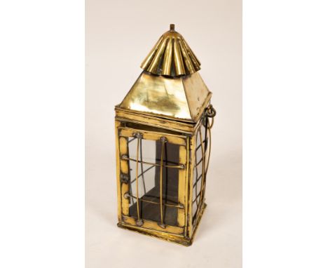 A brass lantern with glazed sides, 40.5cm high and two brass taps CONDITION REPORT: The glass with some scratches but no defi