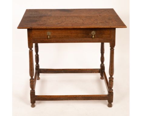 An 18th Century oak side table, fitted a single drawer on turned legs with stretchers, 85.5cm wide CONDITION REPORT: The top 