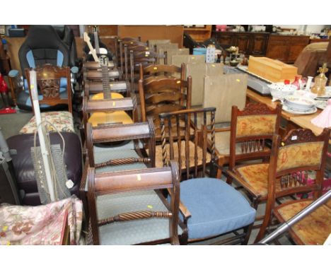 Four oak ladder back chairs; two rush seated ladder back chairs and a rush seated elbow chair