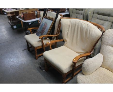 A pair of stick back armchairs