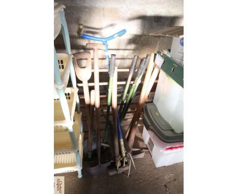 A quantity of long handled gardening tools