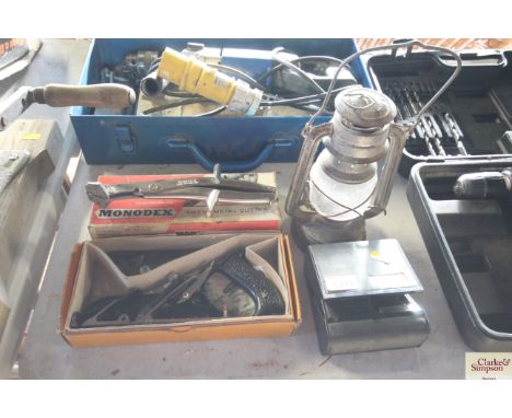 A Monodex sheet metal cutter; a No. 78 plane; a Remington shaver and a Tilley style lamp