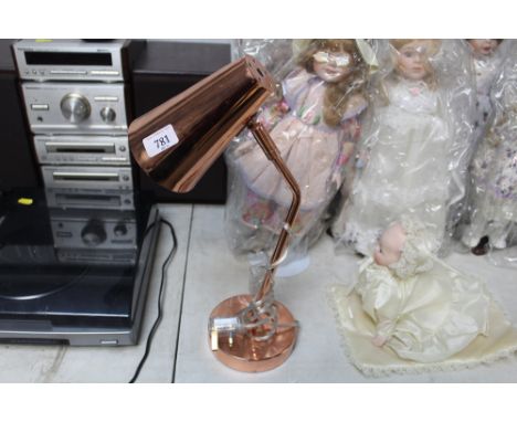 A copper effect Anglepoise style lamp