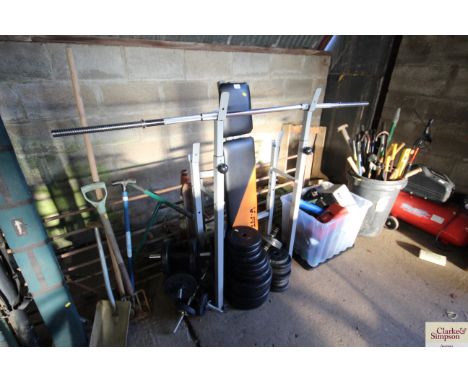 A Vfit weight bench with various weights; two pairs of dumbbells; beginners lifting bar; and an ab exercise wheel 