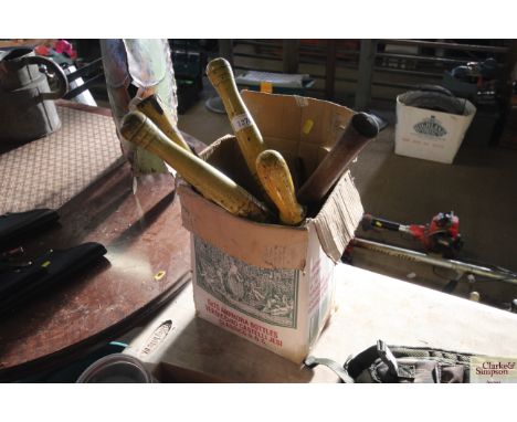 A box containing gardening tools to include shears; axe; fork etc