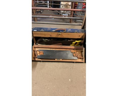 A wooden carpenters tool chest complete with a large quantity of vintage carpenters tools