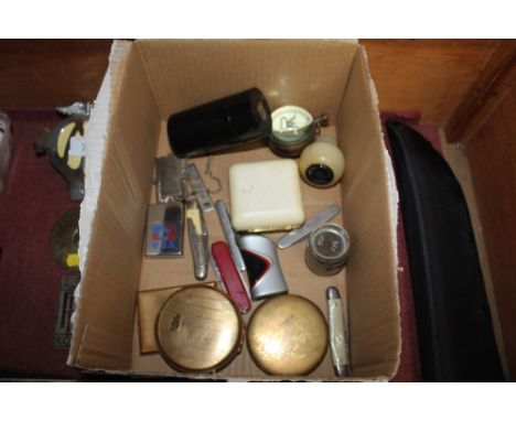 A box containing reproduction ball clock; travelling clock; compacts; penknives etc.