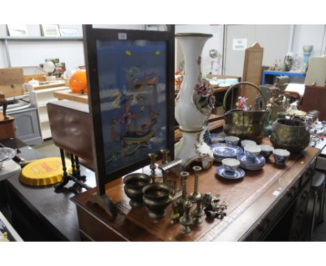 An oak needlework fire screen and a collection of brass ware including candle sticks; vases etc.