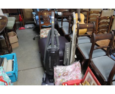 An Electrolux upright vacuum cleaner; a Hoover vacuum cleaner sold as collectors item and two pairs of curtains