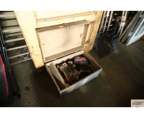 A metal bound box and contents of various hand tools