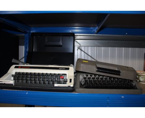 An Olympia typewriter together with another