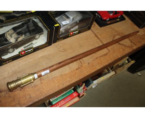 A reproduction brass mounted walking stick