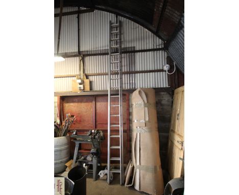 An extending aluminium ladder