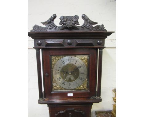 Unusual small oak longcase clock, the square hood with floral surmount and flanking pilasters above a shaped panel door and c