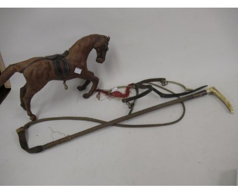 Silver collared horn handled and woven riding crop, pair of steel and leather strapped spurs and a leather covered model of a