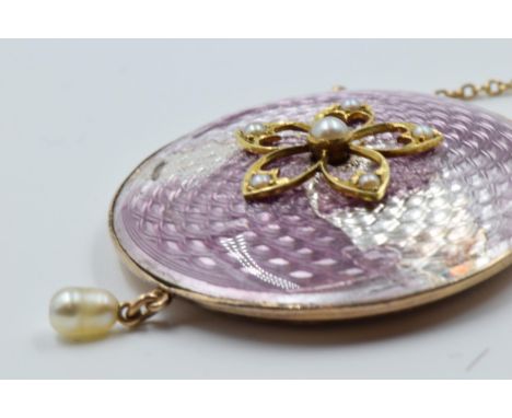 9ct yellow gold and enamel circular locket/pendant, set with split pearls on a gold chain (at fault)The losses to the enamel 