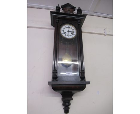 Small late 19th Century Vienna type wall clock, the shaped surmount above a circular enamel dial with Roman numerals and two 
