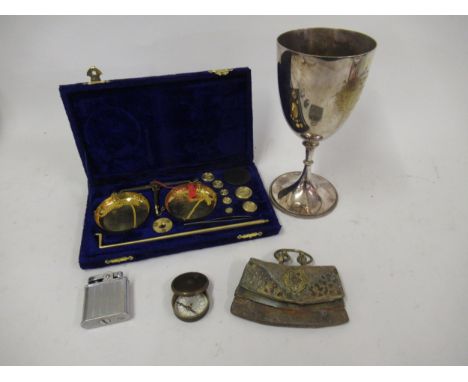 Small Middle Eastern brass and leather purse, a brass cased pocket compass, cigarette lighter, plated trophy cup and a pair o