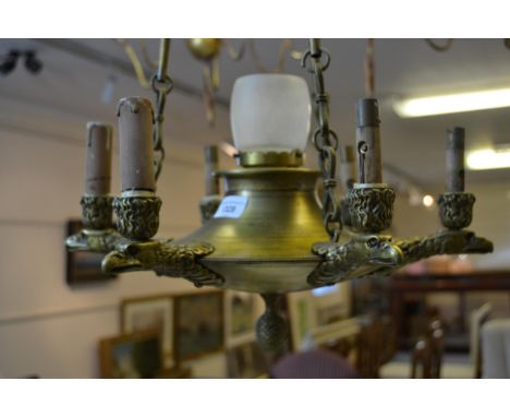 Early 20th Century Gilt bronze six branch hanging  light fitting on cast chains with central glass shade, 16ins diameter x 48