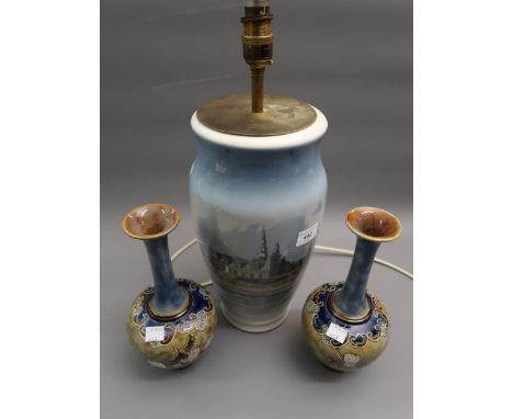 Large Royal Copenhagen table lamp decorated with a cityscape, 11ins high excluding the shade, together with a pair of Doulton
