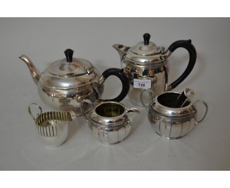 Silver plated four piece tea service, with sugar tongs and a small silver plated cream jug 