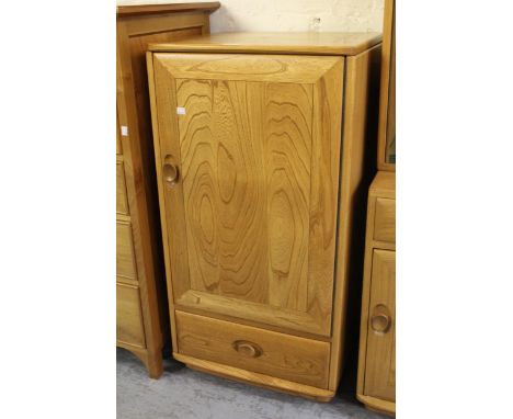 Ercol hi-fi cabinet, the hinged lid above a panel door and single drawer, 19.5ins x 38.75ins together with a matching TV stan