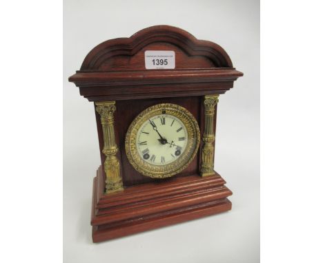 Early 20th Century American Ansonia mahogany mantel clock, the ceramic dial with Roman numerals and a two train movement stri